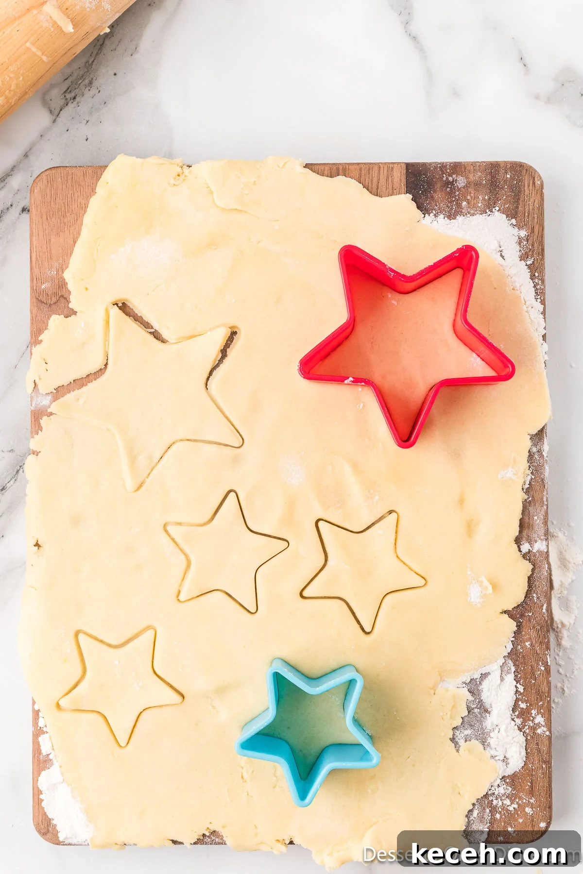 Batter rolled out and cookie cutters to make shapes. 