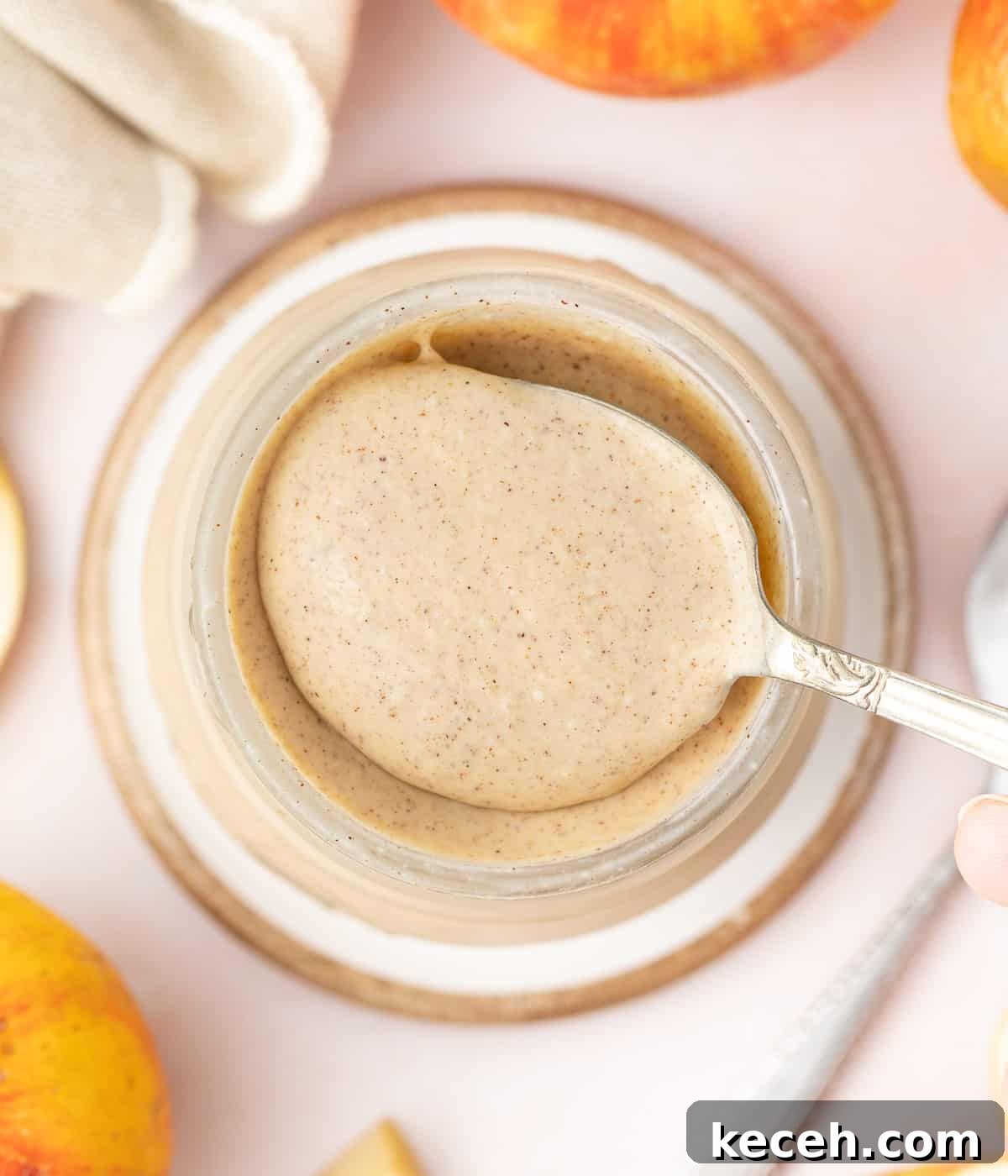 Apple Curd Recipe: Smooth Homemade Apple Spread 6 Curd picked on a spoon seen from above.