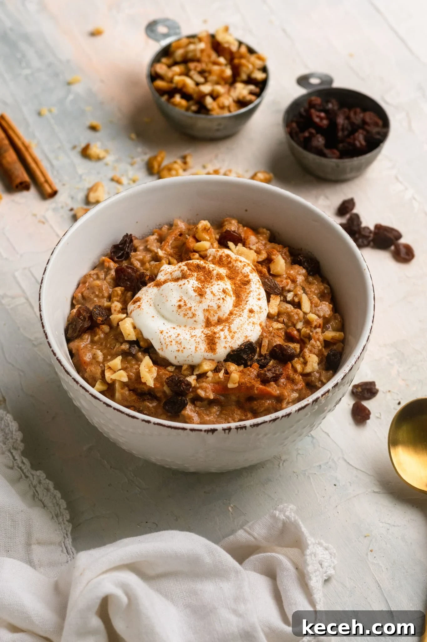 Carrot Cake Oatmeal Recipe: Spiced Overnight Oats with Carrot and Walnut 2 carrot cake oatmeal in a bowl topped with Greek yogurt and cinnamon