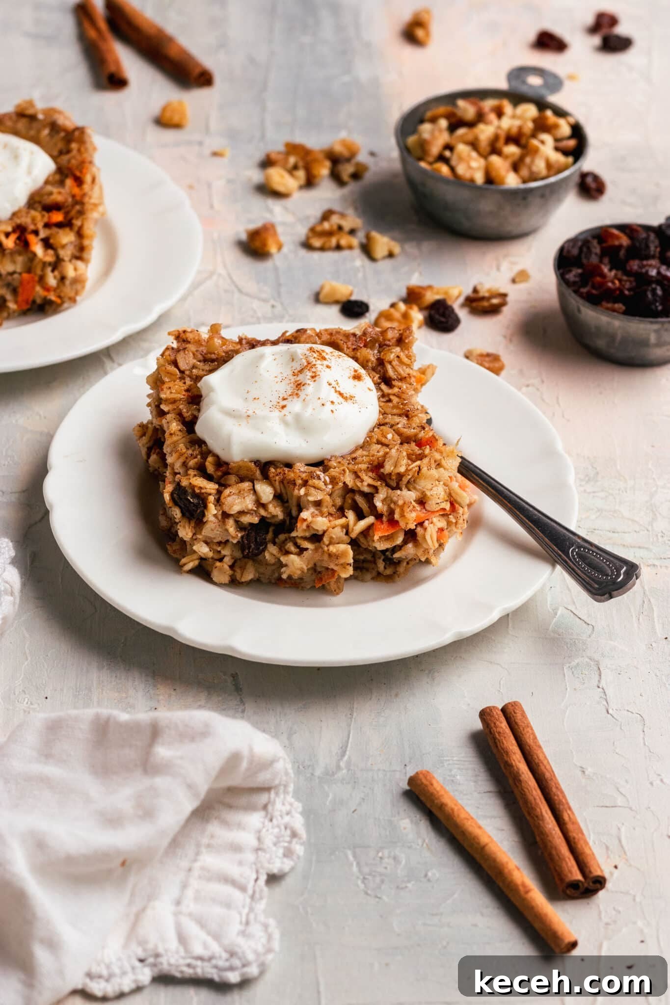 Carrot Cake Oatmeal Recipe: Spiced Overnight Oats with Carrot and Walnut 6 a sliced of baked oatmeal on a white plate