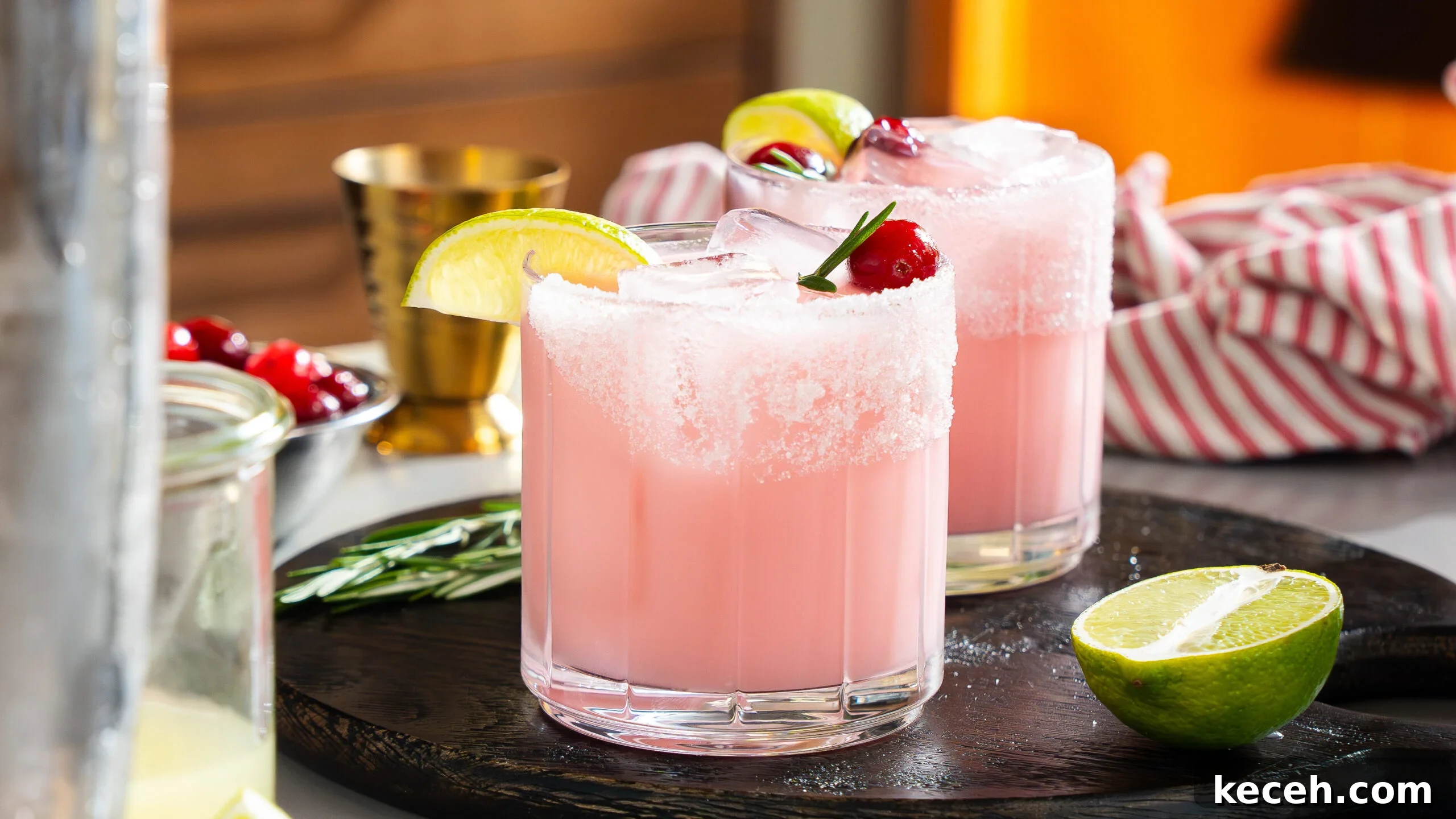 Cranberry Coconut Lime Christmas Margarita Recipe 8 Christmas margaritas in a glass with lime, ice and cherries.