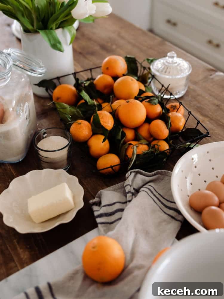 No-Fail Orange Curd Recipe — Smooth, Tangy, Homemade 4 Ingredients for orange curd on wood countertop: oranges, butter, eggs, sugar.