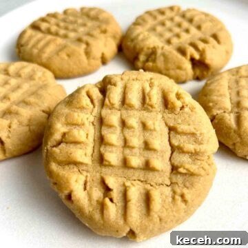 Chewy Peanut Butter Cookies Recipe with Crispy Edges 9 close up of peanut butter cookies on plate.