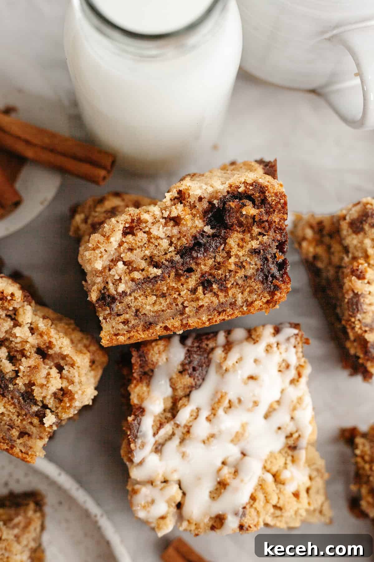 Moist Banana Coffee Cake with Sour Cream Glaze 2 Square slices of banana coffee cake, some slices are drizzled with a white glaze.