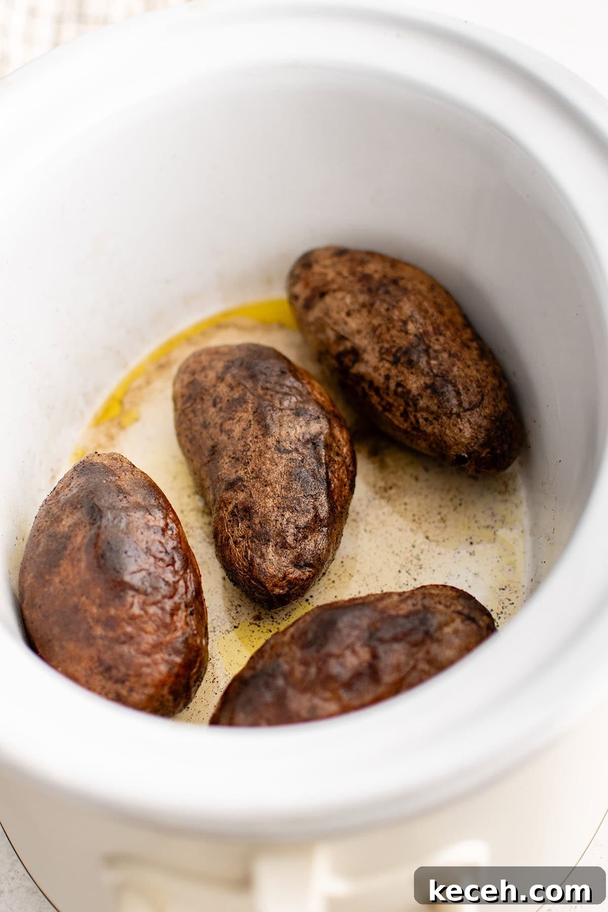 photo of baked potatoes in the slow cooker