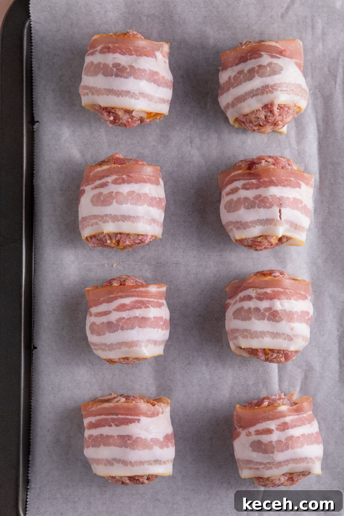 Divide the stuffing mix into balls, wrap in bacon and then roast.