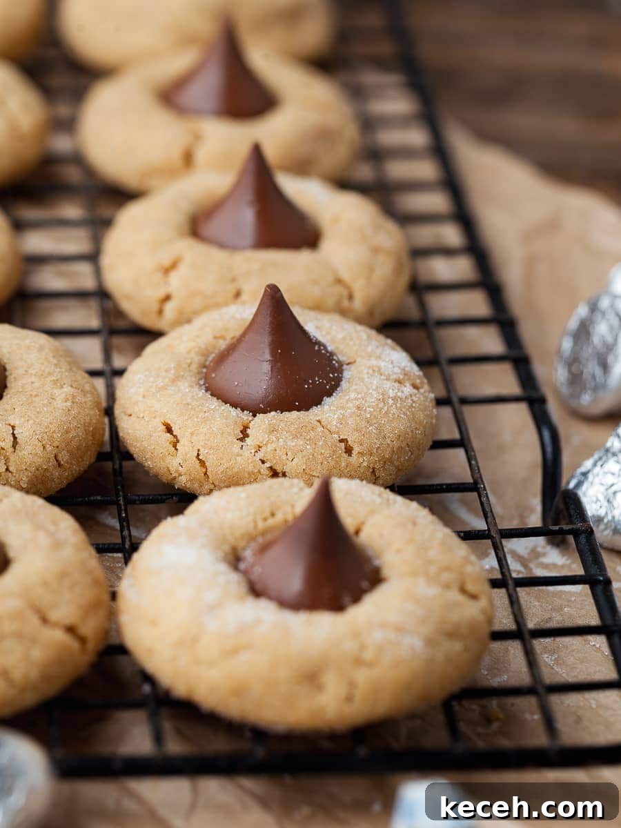 Gluten-Free Peanut Butter Blossoms Cookies Recipe 4 gluten free peanut butter blossoms on a cooling rack