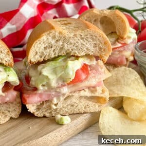 Copycat Grinders Italian sandwich cut in half for serving.