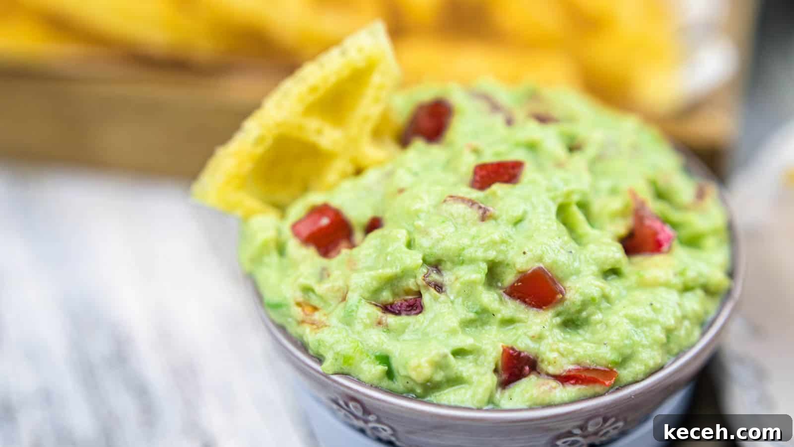 13 Delicious Low-Carb Mexican Recipes Worth Trying 10 Guacamole Dip with Sour Cream in a bowl with chips.