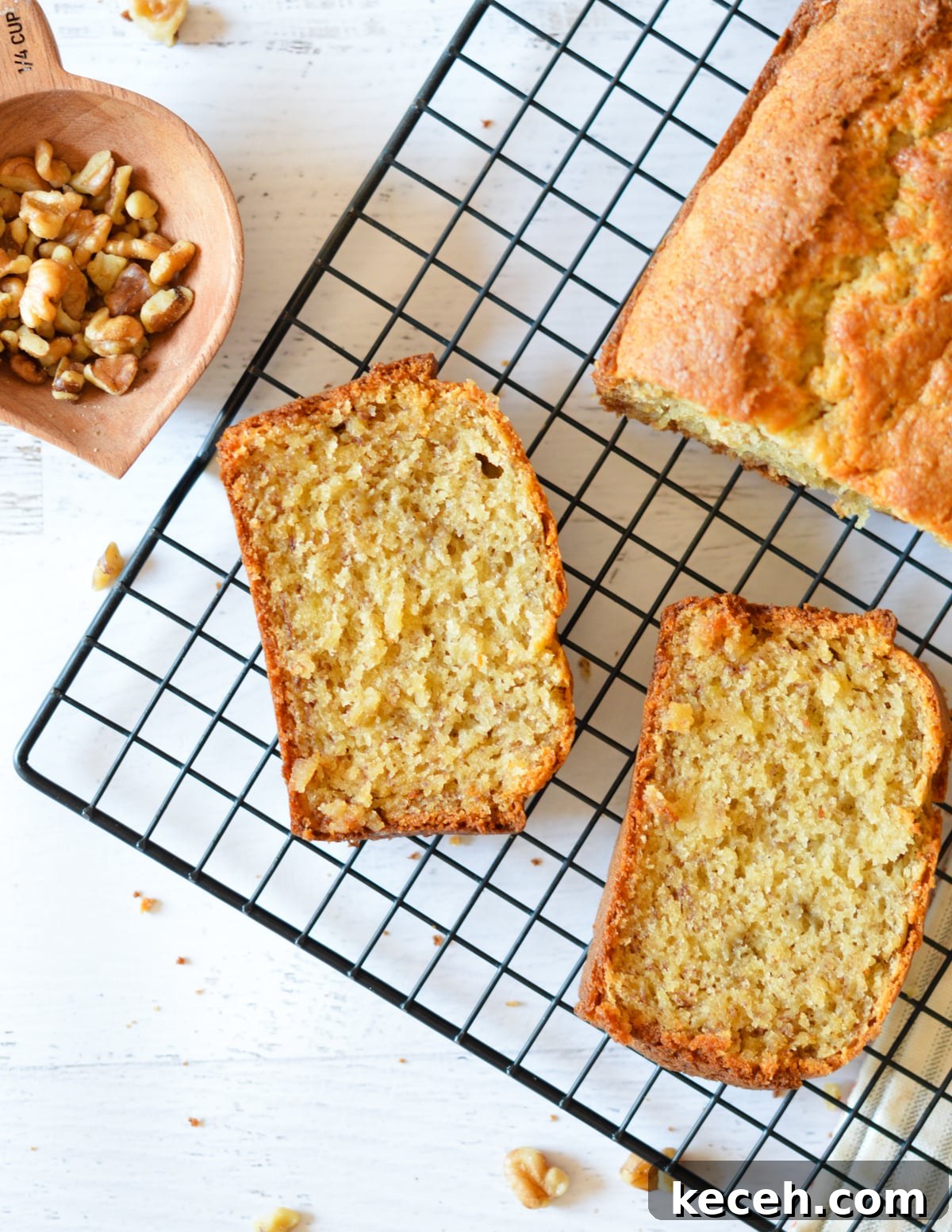 Moist Banana Bread Made with Frozen Bananas 14 banana bread slices on a cooling rack.