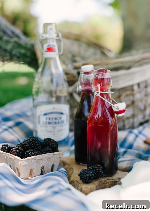 Blackberry Shrub Lemonade in glass bottles.