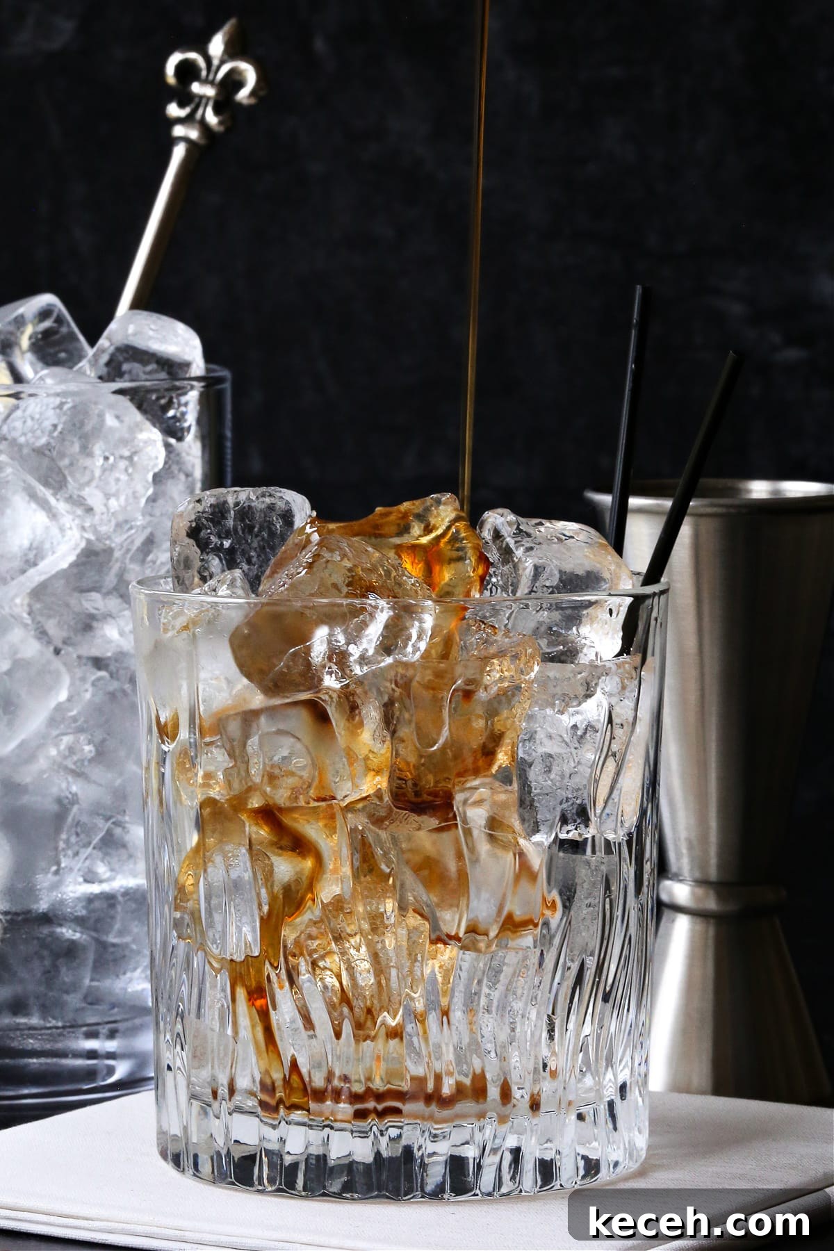 A classic White Russian recipe is a favorite with coffee lovers. A creamy, coffee-infused cocktail that's wonderful as an after dinner drink. kahlua being poured into low ball glass with ice