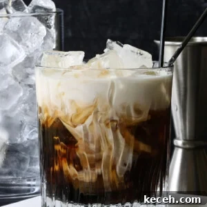 white russian cocktail with ice and metal shot glass