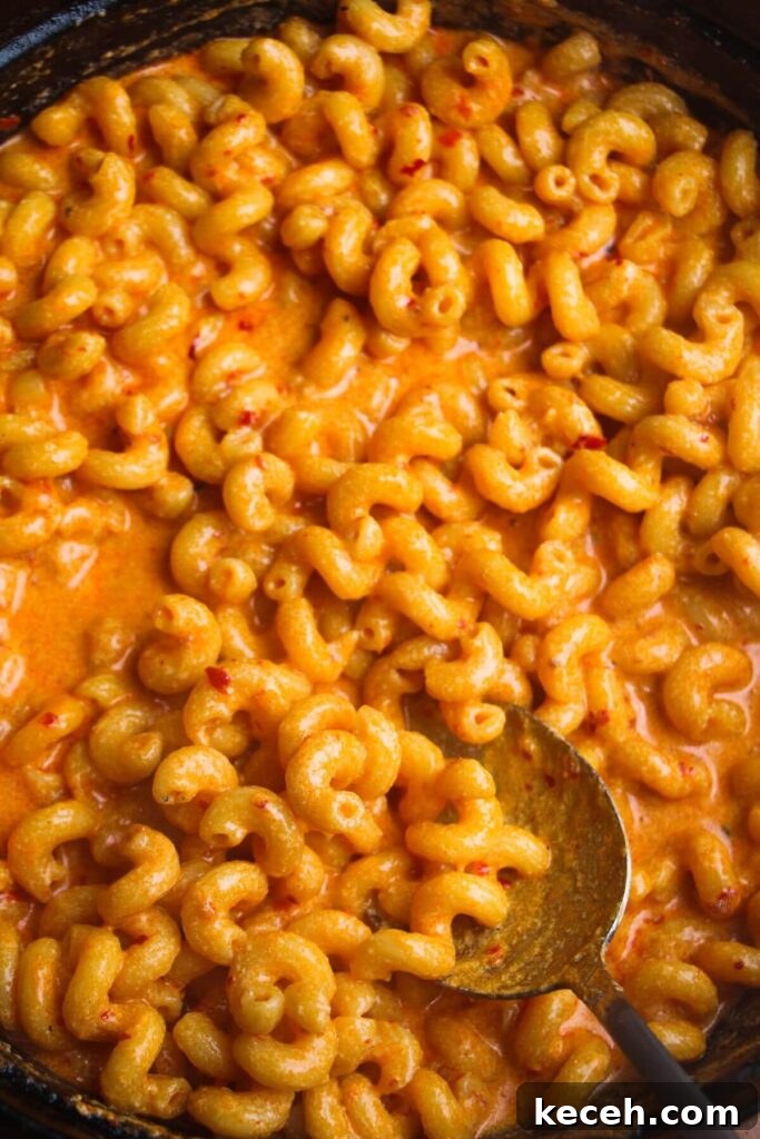 Creamy Spicy One-Pot Mac and Cheese Recipe 9 Close up of spicy mac and cheese in a large black skillet.