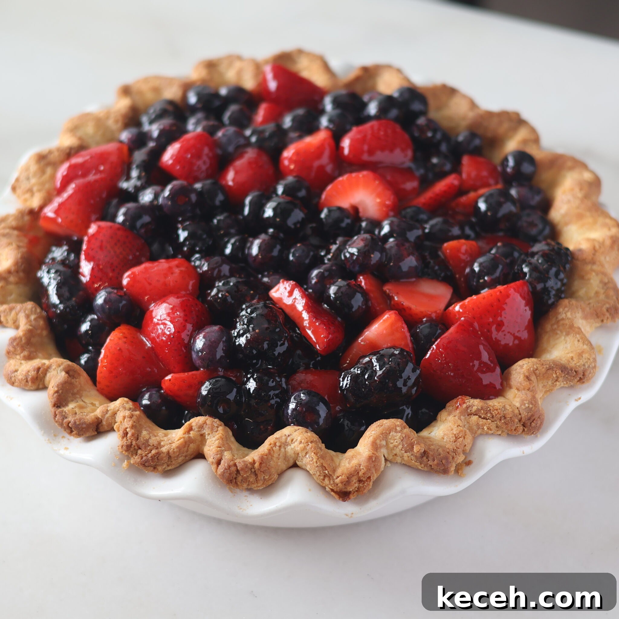 Gluten-Free Mixed Berry Pie Recipe — Fresh Summer Dessert 10 whole pie on marble surface.