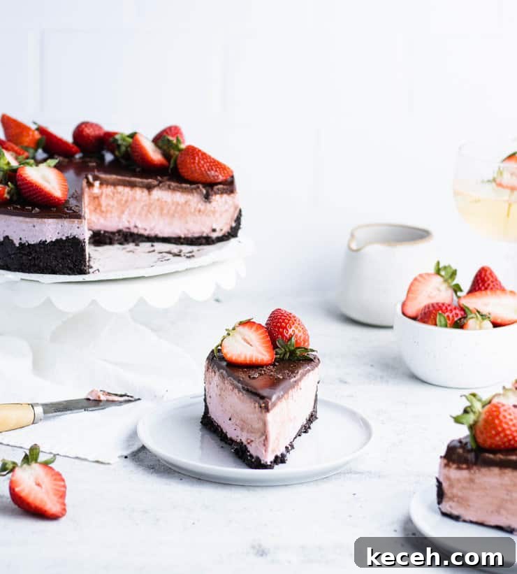 Chocolate Ganache Recipe: Smooth, Glossy Ganache in Minutes 3 Slice of chocolate strawberry cheesecake on a blue plate in front of the rest of the cake, a bowl of strawberries, a ceramic pitcher and a glass of wine.