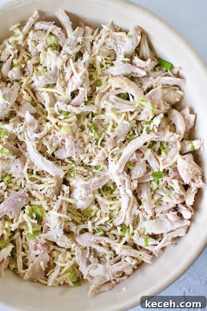 Making the chicken mixture for filling the flautas.