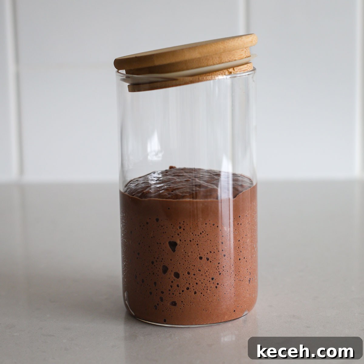 Sourdough Chocolate Starter: How to Make It and What to Use It For 6 Chocolate sourdough starter in a glass jar.