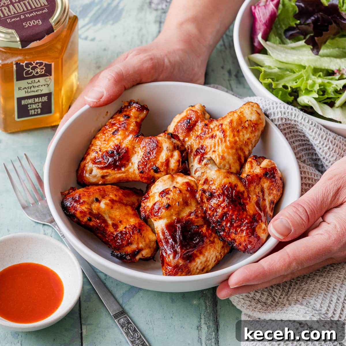 Crispy Honey-Glazed Air Fryer Chicken Wings 2 Honey chicken air fryer wings in a bowl