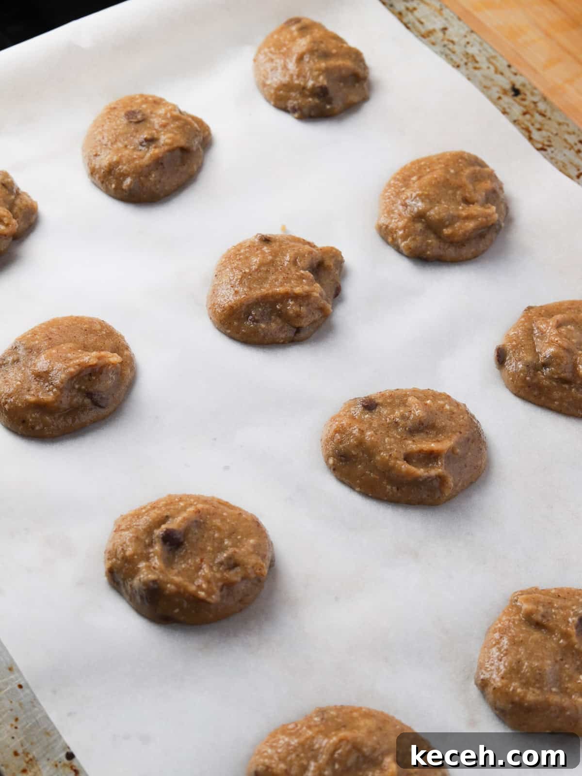 Photo of cookie dough on a baking sheet ready to go in the oven.