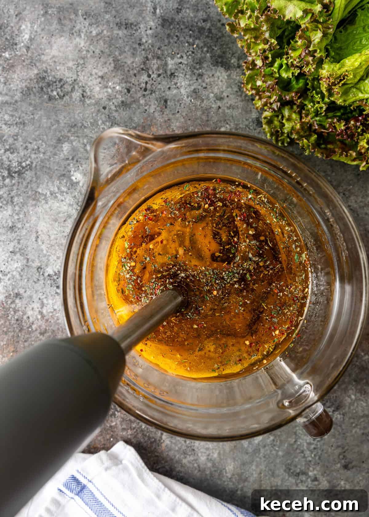 Two Homemade Italian Salad Dressings: Classic & Zesty Variations 5 overhead process shot: blending my Italian salad dressing recipe in a glass measuring cup with immersion blender