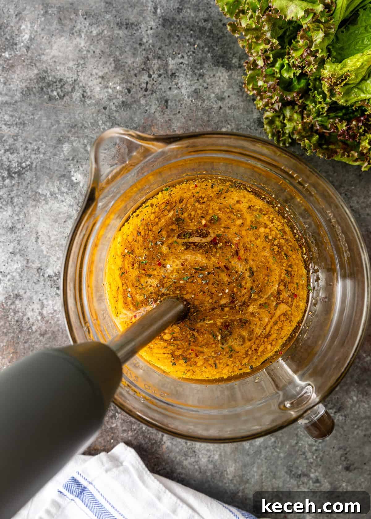 Two Homemade Italian Salad Dressings: Classic & Zesty Variations 6 overhead process shot: blending homemade Italian dressing in a glass measuring cup with immersion blender
