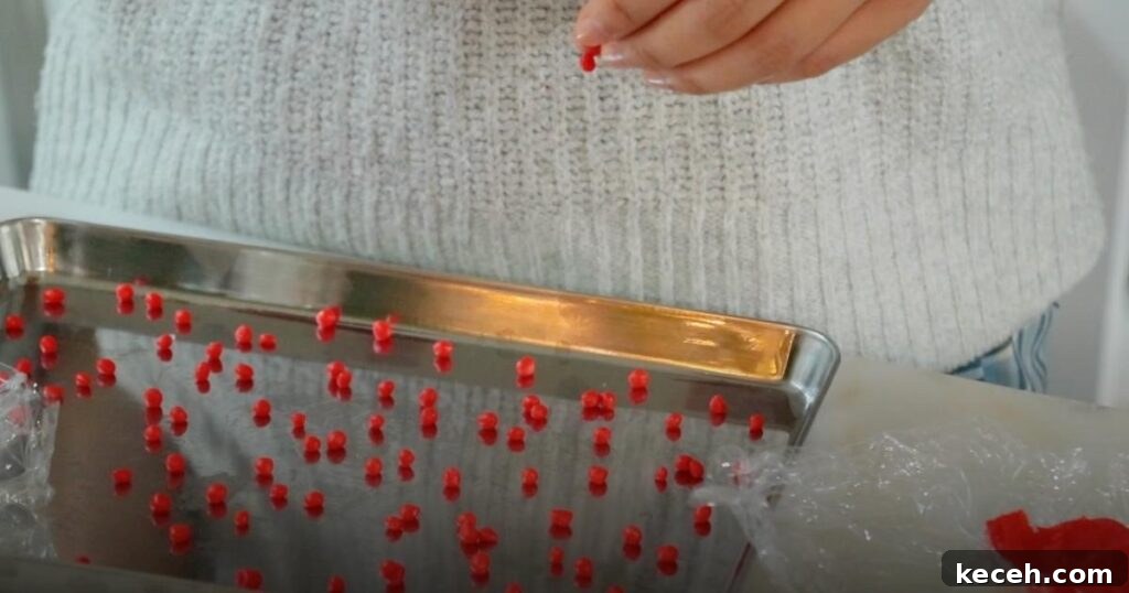 Slice-and-Bake Christmas Cookies: Quick Holiday Cookie Recipes 15 making tiny balls with red cookie dough