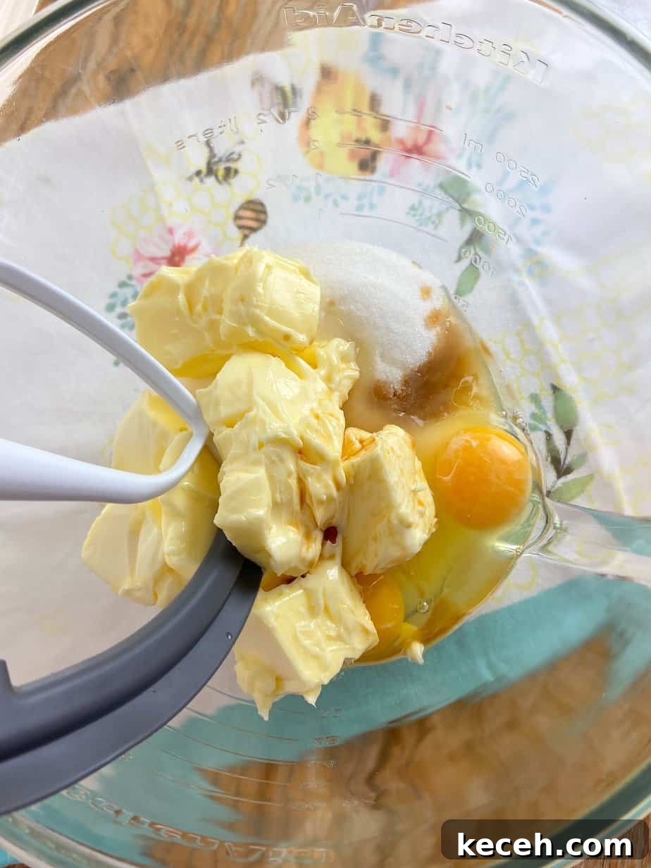 Perfect Cookie Dough Recipe for Baking and Safe Snacking 5 Butter, sugar, eggs and vanilla extract in mixing bowl.