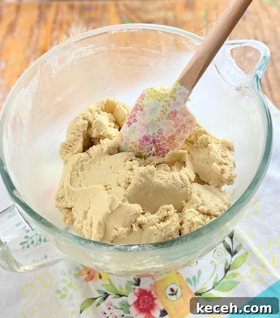 Perfect Cookie Dough Recipe for Baking and Safe Snacking 6 Cookie dough batter in clear mixing bowl.