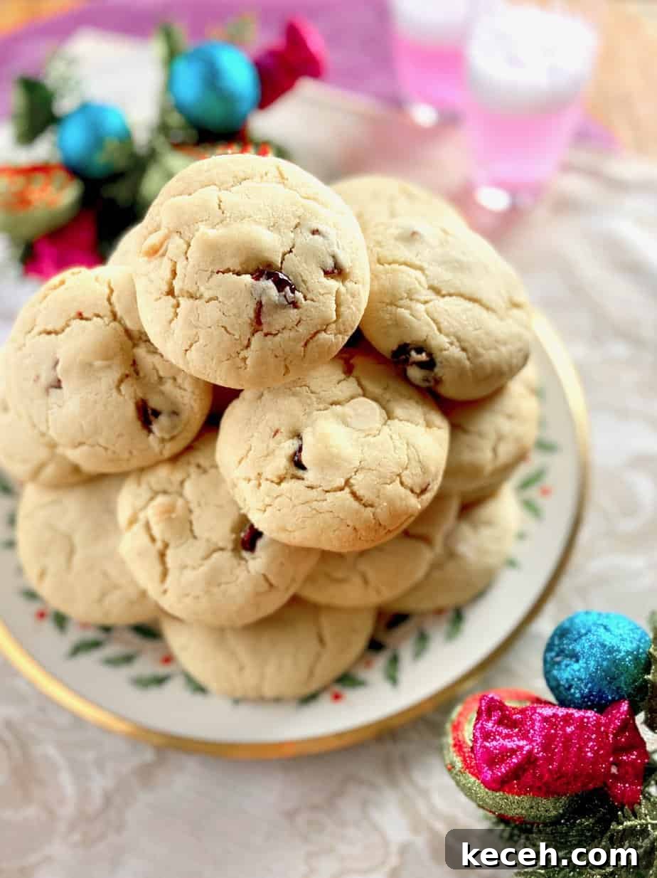 Perfect Cookie Dough Recipe for Baking and Safe Snacking 9 White chocolate and Cranberry cookies stacked on decorative plate.