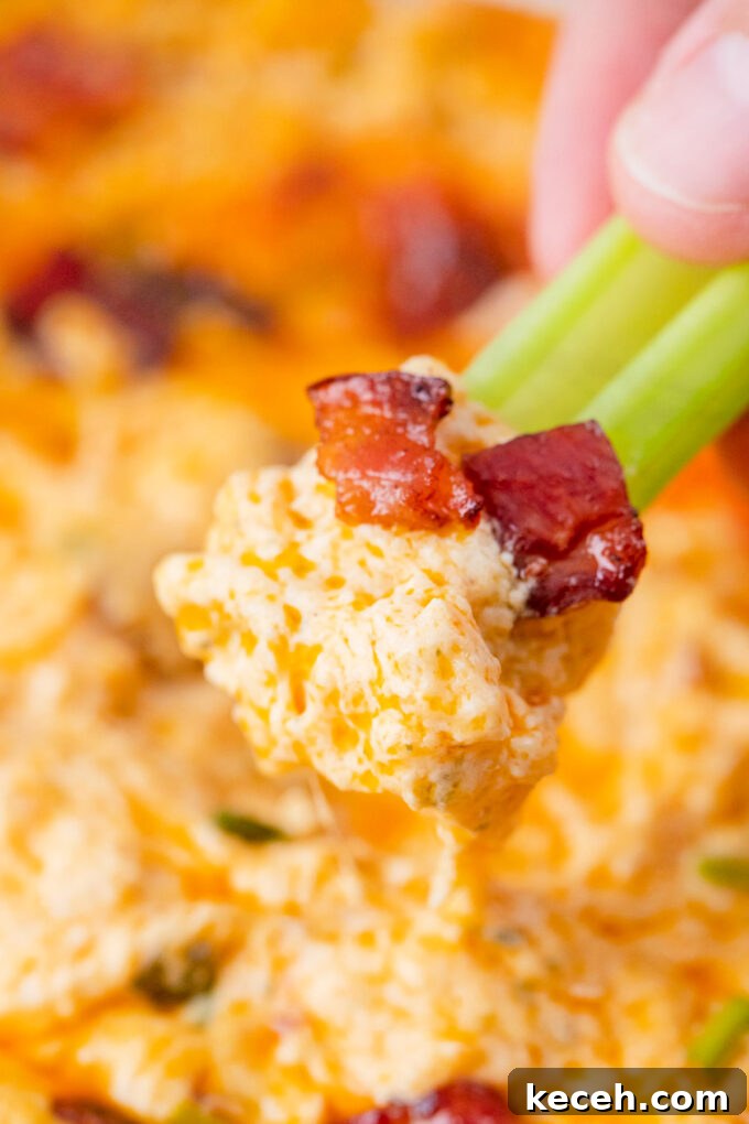 One-Bowl Buffalo Chicken Dip Recipe for Game Day 11 Buffalo crack chicken dip on a celery stick.