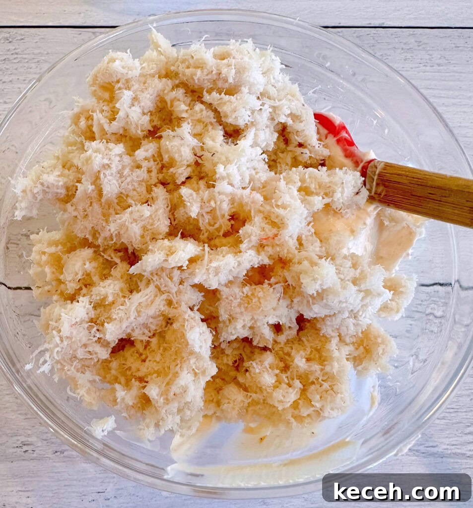 Classic Crab Rangoon Recipe: Crispy Crab & Cream Cheese Wontons 4 Crab and cream cheese in a mixing bowl.