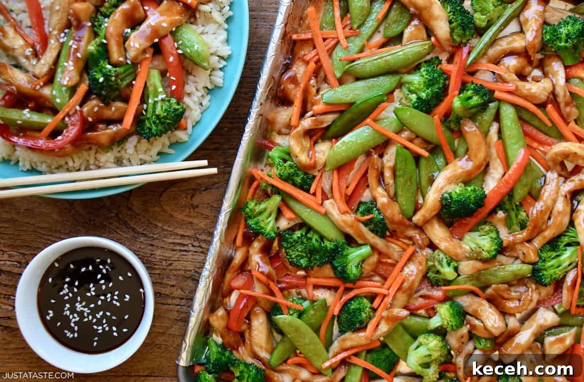 Sheet Pan Teriyaki Chicken with Roasted Vegetables 8 Baked teriyaki chicken and roasted vegetables arranged on a foil-lined sheet pan.