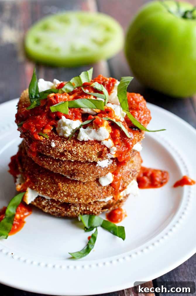 Crispy Fried Green Tomatoes with Goat Cheese & Roasted Red Pepper Vinaigrette 2 Fried Green Tomatoes with Goat Cheese and Roasted Red Pepper Vinaigrette. This Southern-meets-Italian appetizer is bound to be a late-summer favorite. I crave it all year long! | hostthetoast.com