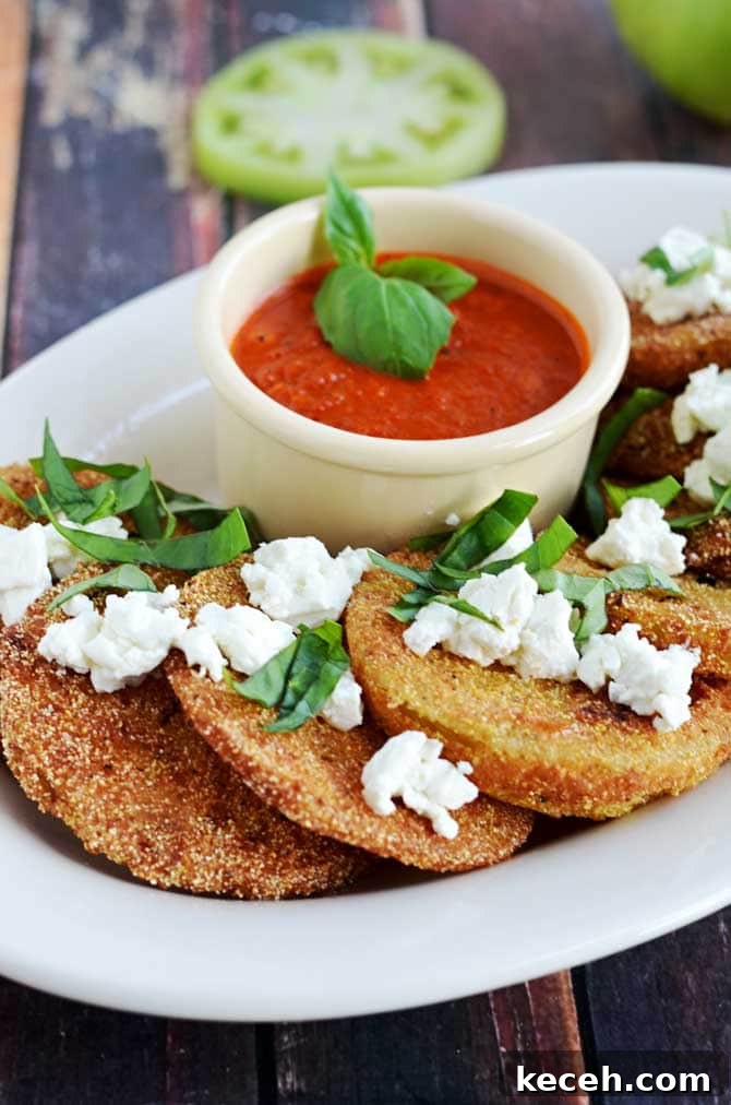 Crispy Fried Green Tomatoes with Goat Cheese & Roasted Red Pepper Vinaigrette 5 Fried Green Tomatoes with Goat Cheese and Roasted Red Pepper Vinaigrette. This Southern-meets-Italian appetizer is bound to be a late-summer favorite. I crave it all year long! | hostthetoast.com