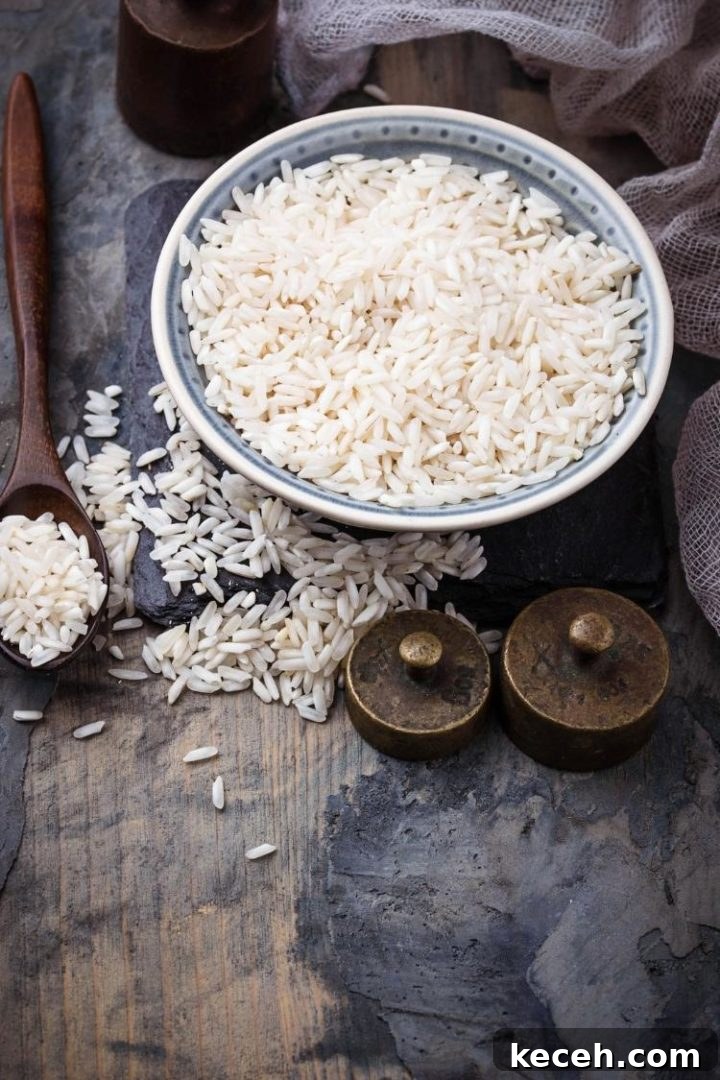 Instant Pot Rice: Perfect Fluffy Rice Every Time 3 bowl of uncooked white rice on a wooden table