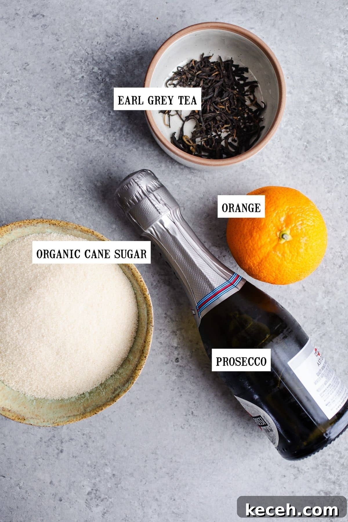 Earl Grey Prosecco Cocktail Recipe: Sparkling Tea-Infused Drink 3 Ingredients to make a tea cocktail on a table.