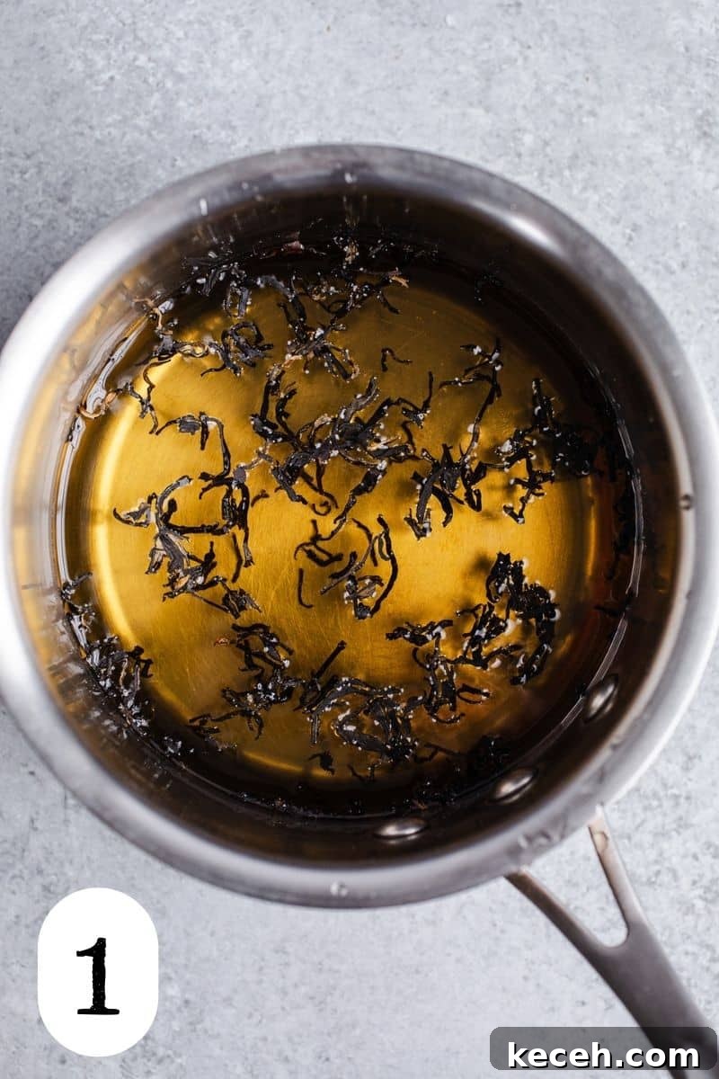 Earl Grey Prosecco Cocktail Recipe: Sparkling Tea-Infused Drink 4 Loose leaf tea in sugar syrup in a saucepan.