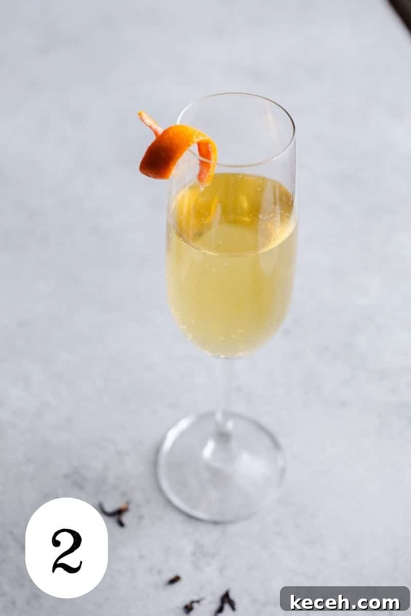 Earl Grey Prosecco Cocktail Recipe: Sparkling Tea-Infused Drink 5 A cocktail in a champagne flute.
