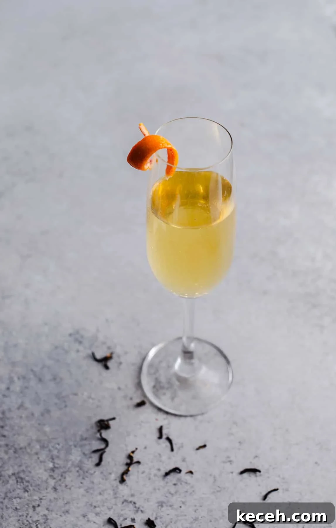 Earl Grey Prosecco Cocktail Recipe: Sparkling Tea-Infused Drink 6 A cocktail with an orange twist.