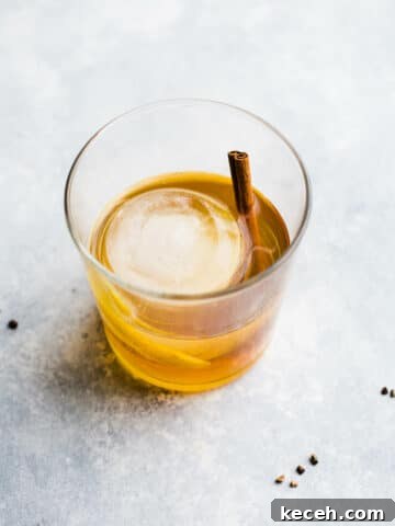 Bourbon cocktail with round ice cube