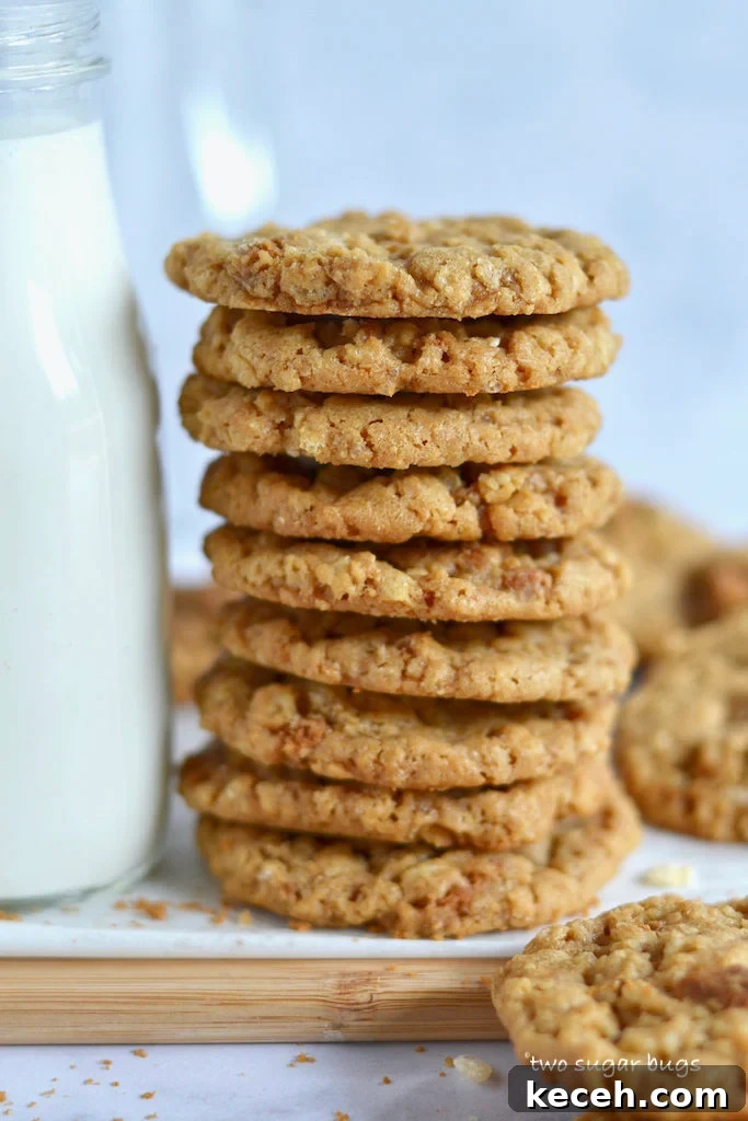 Crunchy Cookie Butter Cookies: Crispy, Spread-Infused Treats 2 Stack of biscoff crispy cookies with a bottle of milk