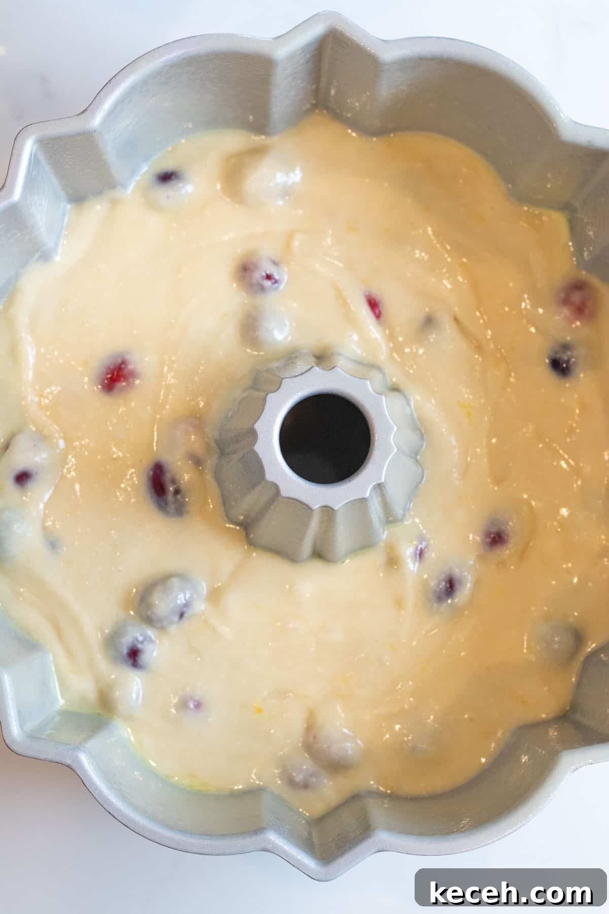 Cranberry-Orange Bundt Cake with Fresh Cranberry Sauce Swirl 5 cranberry orange cake batter in a bundt pan