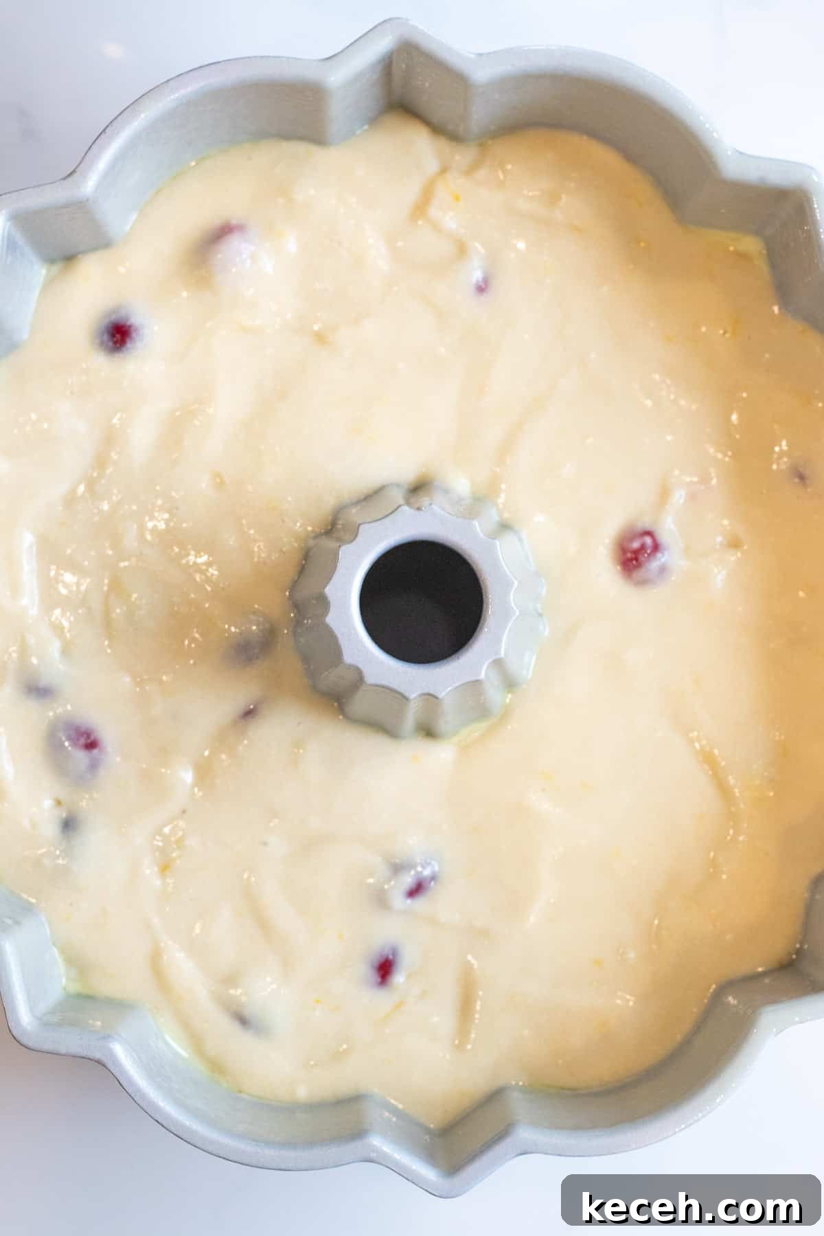 Cranberry-Orange Bundt Cake with Fresh Cranberry Sauce Swirl 7 cranberry orange cake batter in a bundt cake pan