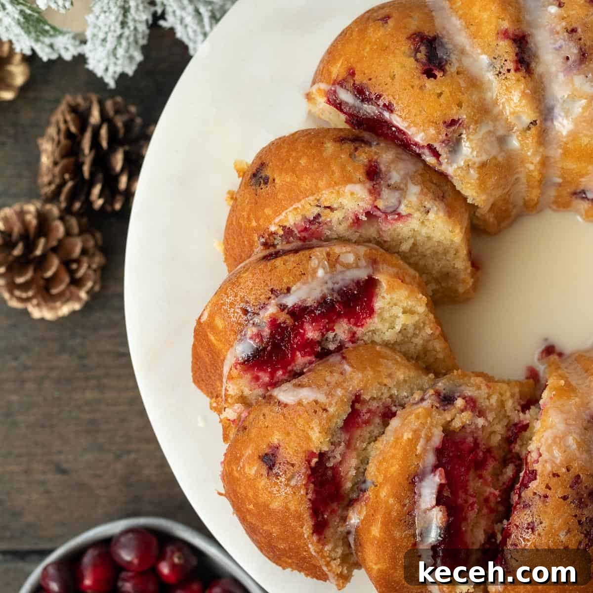 Cranberry-Orange Bundt Cake with Fresh Cranberry Sauce Swirl 10 cranberry orange bundt cake slice and spread out on a marble cake stand