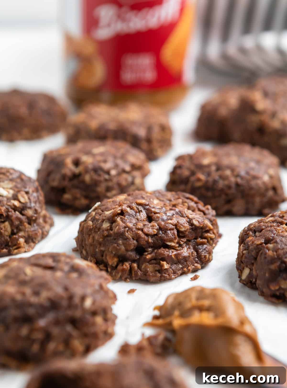 No-Bake Cookie Butter Treats: Quick No-Oven Dessert Recipe 2 No bake cookie butter cookies on parchment.