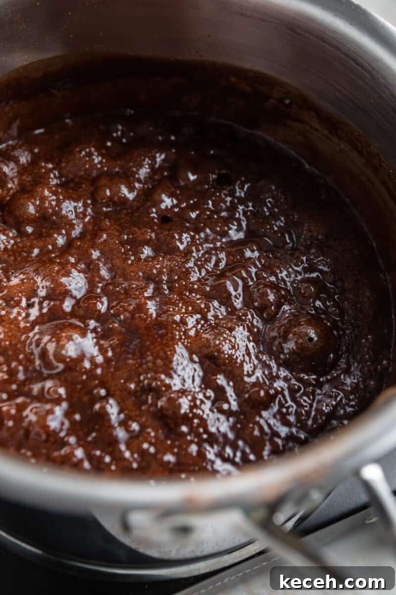 No-Bake Cookie Butter Treats: Quick No-Oven Dessert Recipe 6 Boiling chocolate mixture in saucepan.