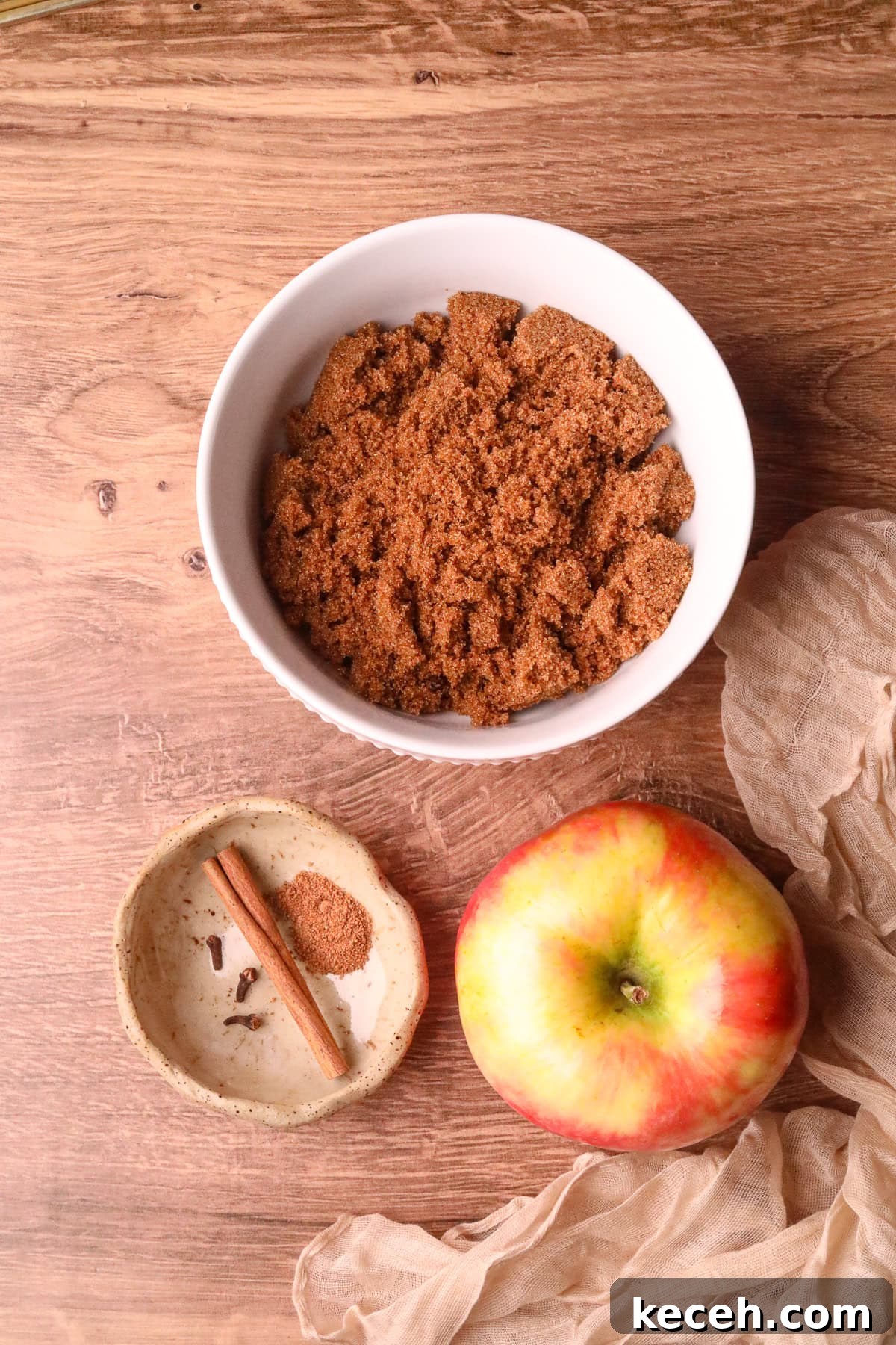 Apple and Brown Sugar Syrup Recipe for Pancakes & Coffee 3 ingredients for making apple brown sugar syrup on a wooden tabletop.
