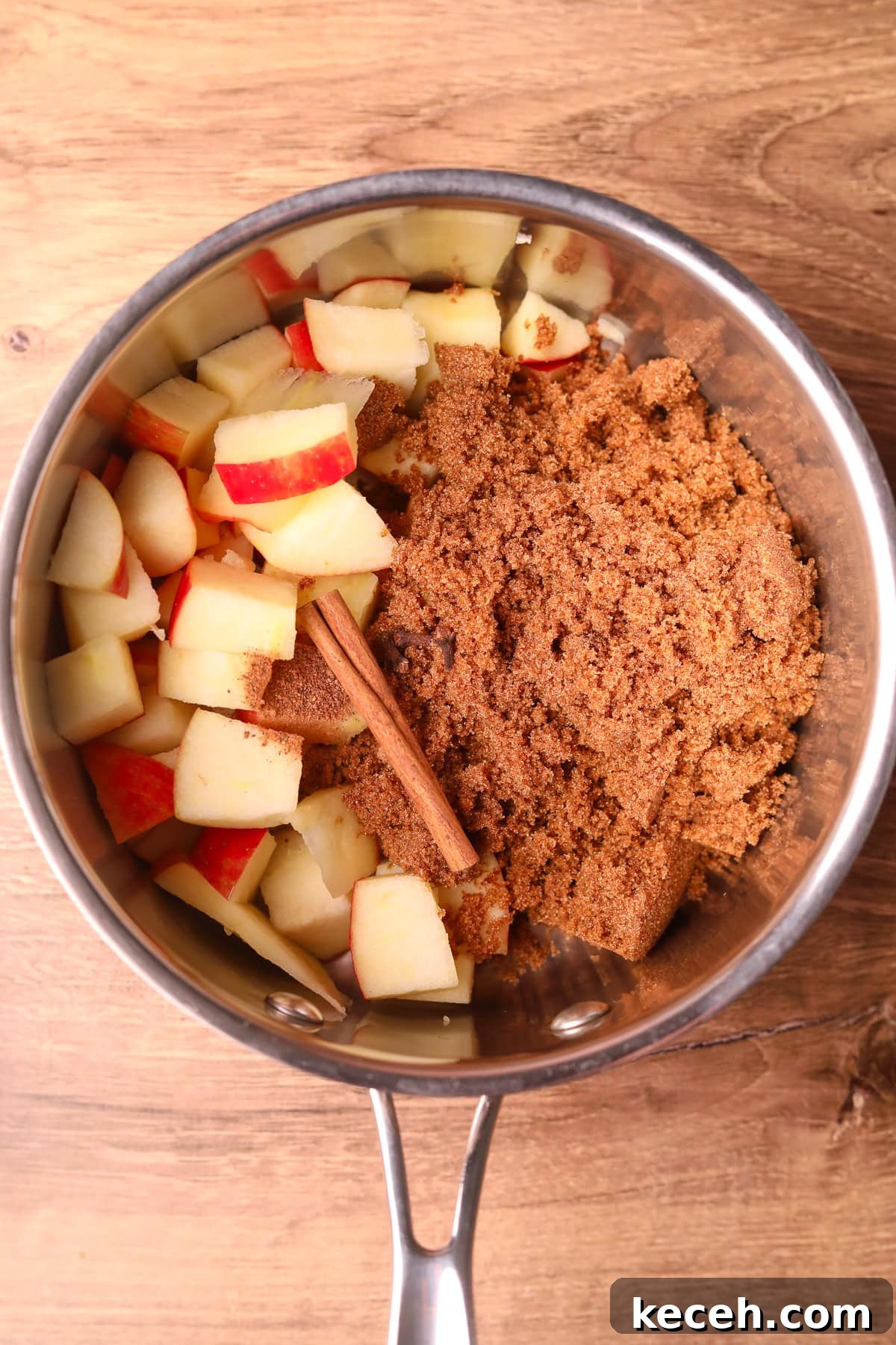 Apple and Brown Sugar Syrup Recipe for Pancakes & Coffee 4 Ingredients for making apple brown sugar syrup in a sauce pan.
