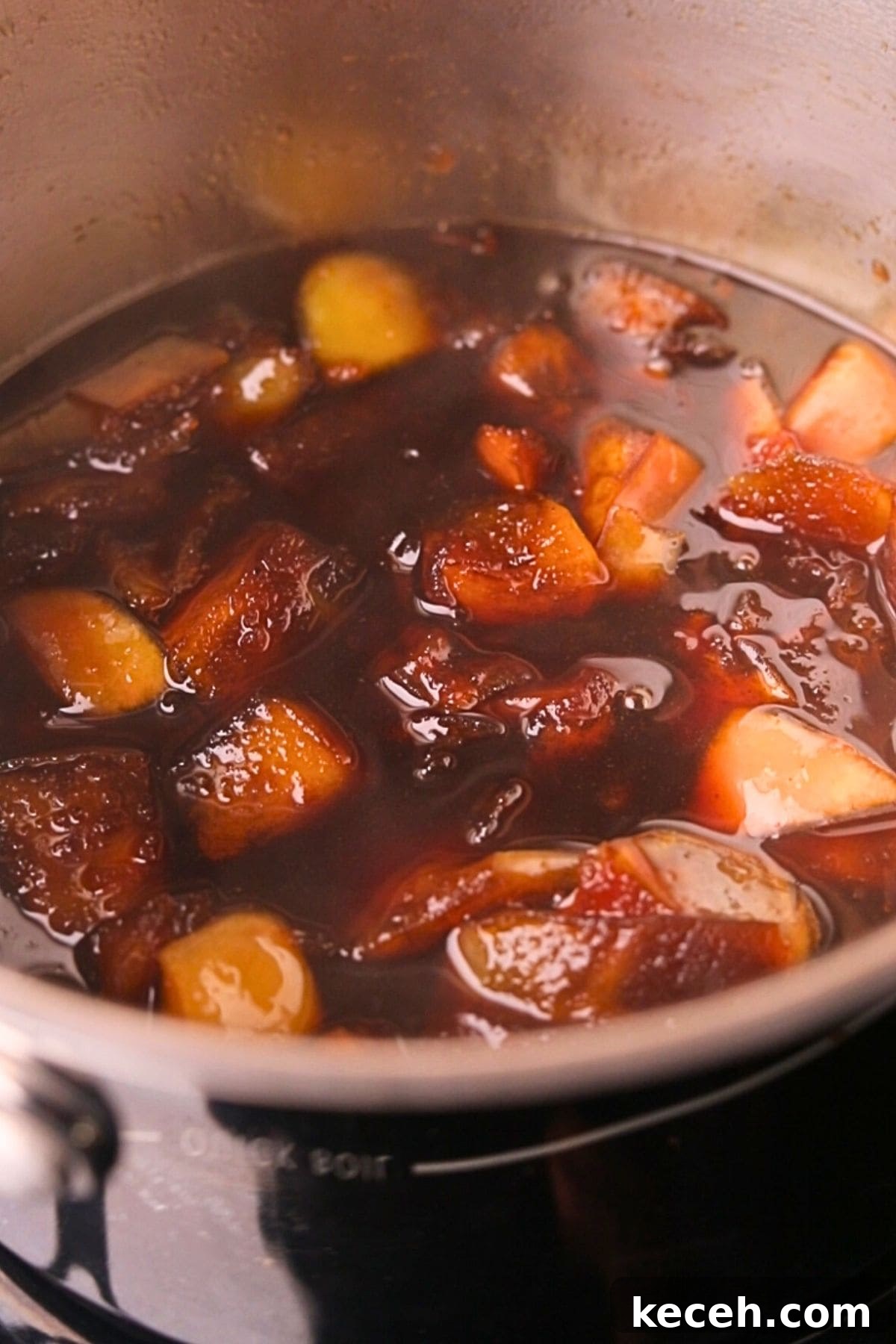 Apple and Brown Sugar Syrup Recipe for Pancakes & Coffee 5 apple brown sugar syrup in a saucepan before straining.